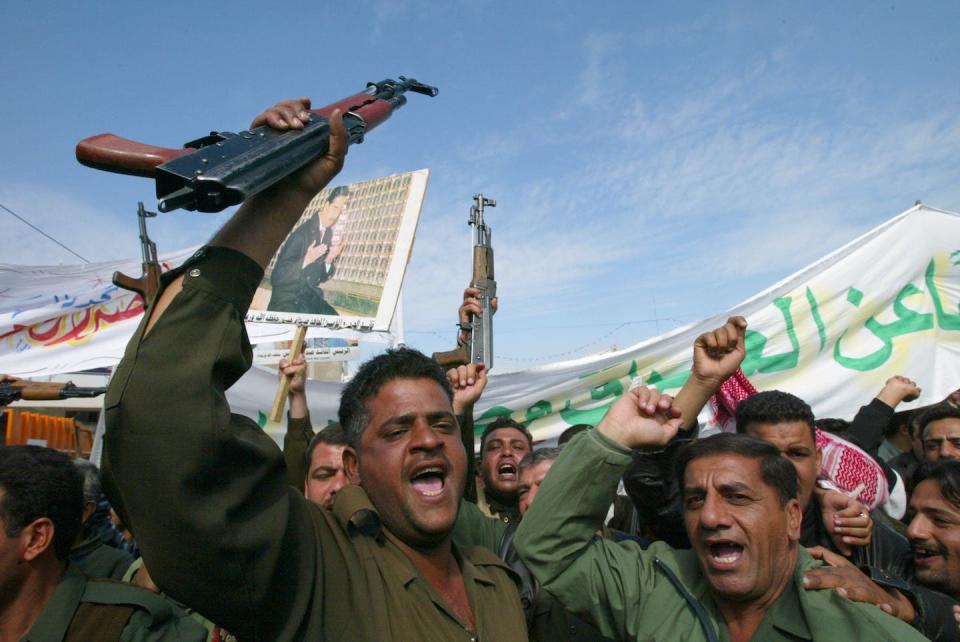 Iraqis demonstrate to show support for Saddam Hussein in February 2003 in Baghdad, Iraq. <a href="https://media.gettyimages.com/id/1798778/photo/activists-in-iraq-rally-for-peace.jpg?s=1024x1024&w=gi&k=20&c=oPWRXG5RzA-kS2bmMT5D9rlLapEelUW5FMqeyCxxqKQ=" rel="nofollow noopener" target="_blank" data-ylk="slk:Oleg Nikishin/Getty Images;elm:context_link;itc:0;sec:content-canvas" class="link ">Oleg Nikishin/Getty Images</a>