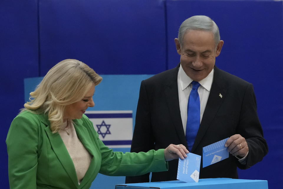 Likud party chairman Benjamin Netanyahu and his wife 'Sara cast their ballots during Israeli elections in Jerusalem, Tuesday, Nov. 1, 2022. (AP Photo/Maya Alleruzzo)