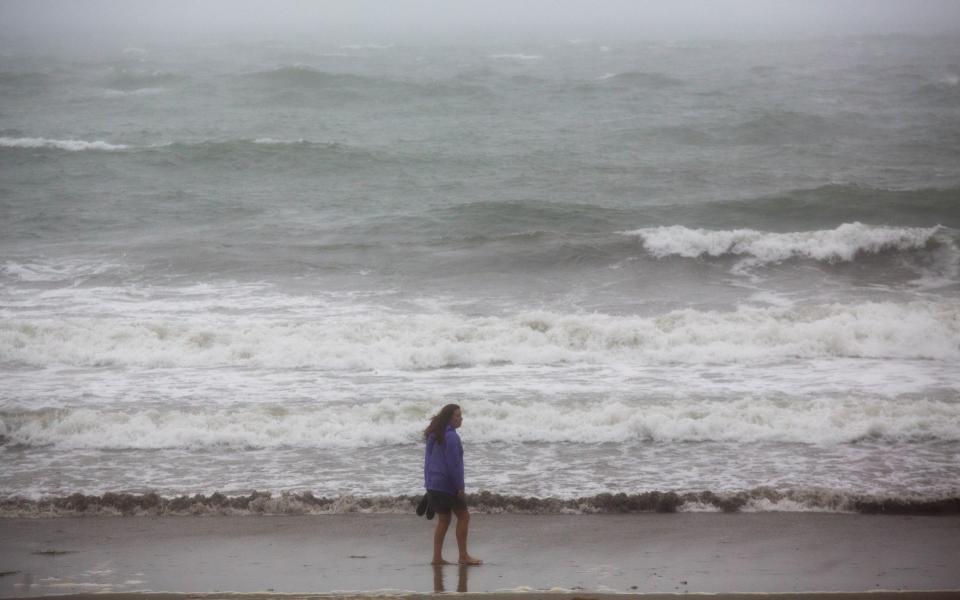 Meanwhile the sea at Looe, Cornwall, looks less than inviting for a summer holiday dip  - SWNS