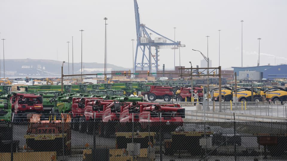 A crane stands idle above farm equipment on Thursday, March 28, 2024, in Dundalk, Md. The deadly collapse of the historic Francis Scott Key Bridge has shaken Baltimore to its core and challenged its cultural identity as a port city that dates back to before the U.S. declared its independence. - Matt Rourke/AP