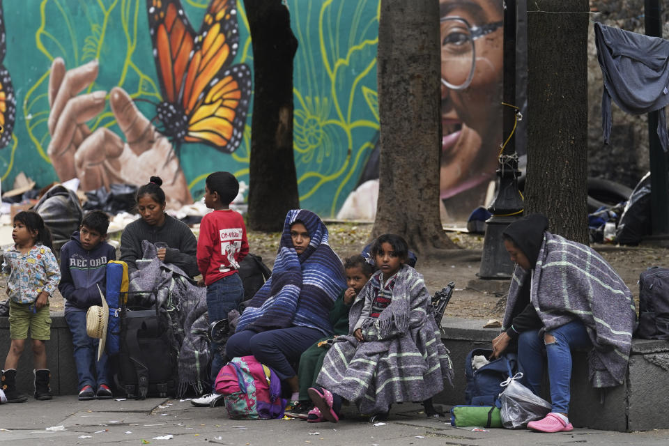 Migrants camp outside the Church of Santa Cruz y La Soledad in Mexico City, Tuesday, Dec. 26, 2023. (AP Photo/Marco Ugarte)
