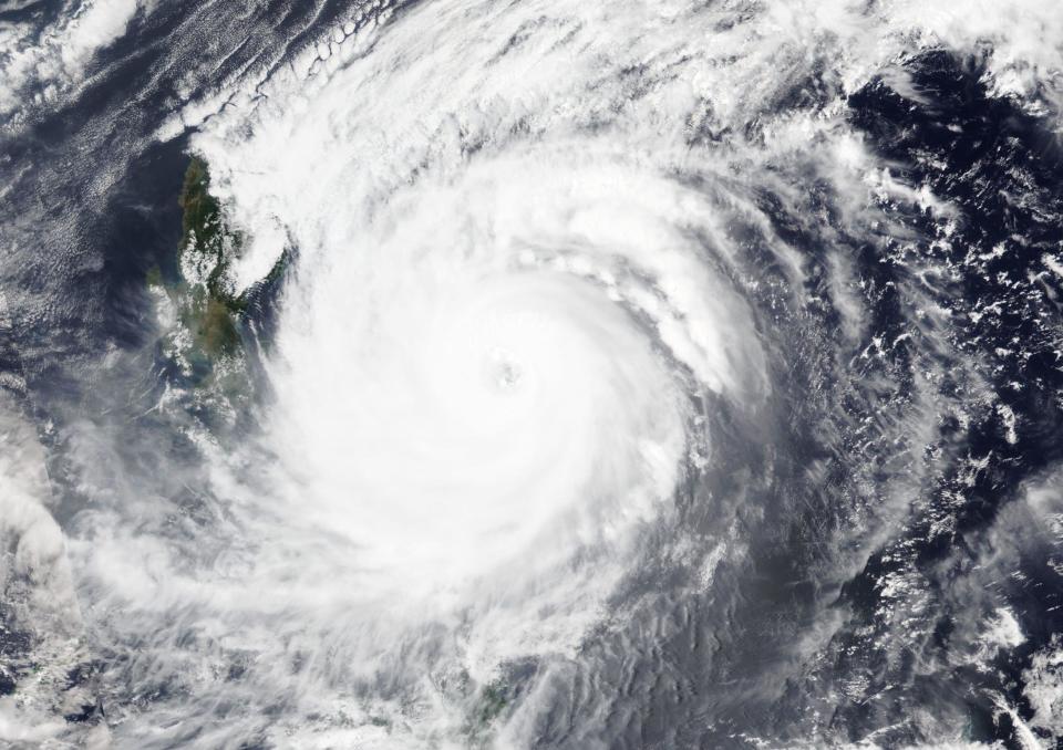 This April, 19, 2021 satellite image released NASA shows typhoon Surigae over Philippines. The approaching typhoon has prompted the evacuation of more than 100,000 people as a precaution in the Philippines, although the unusual summer storm is not expected to blow into land. (NASA Worldview, Earth Observing System Data and Information System (EOSDIS) via AP)