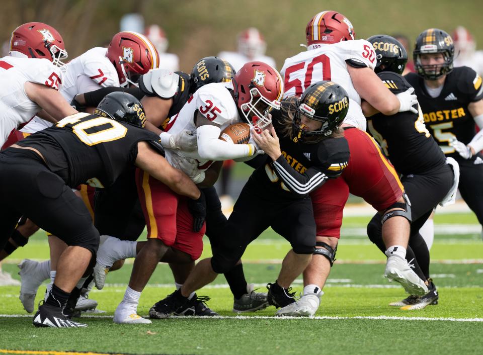 The College of Wooster's defense makes one of many tackles close to the line of scrimmage in a 36-0 win over Oberlin.