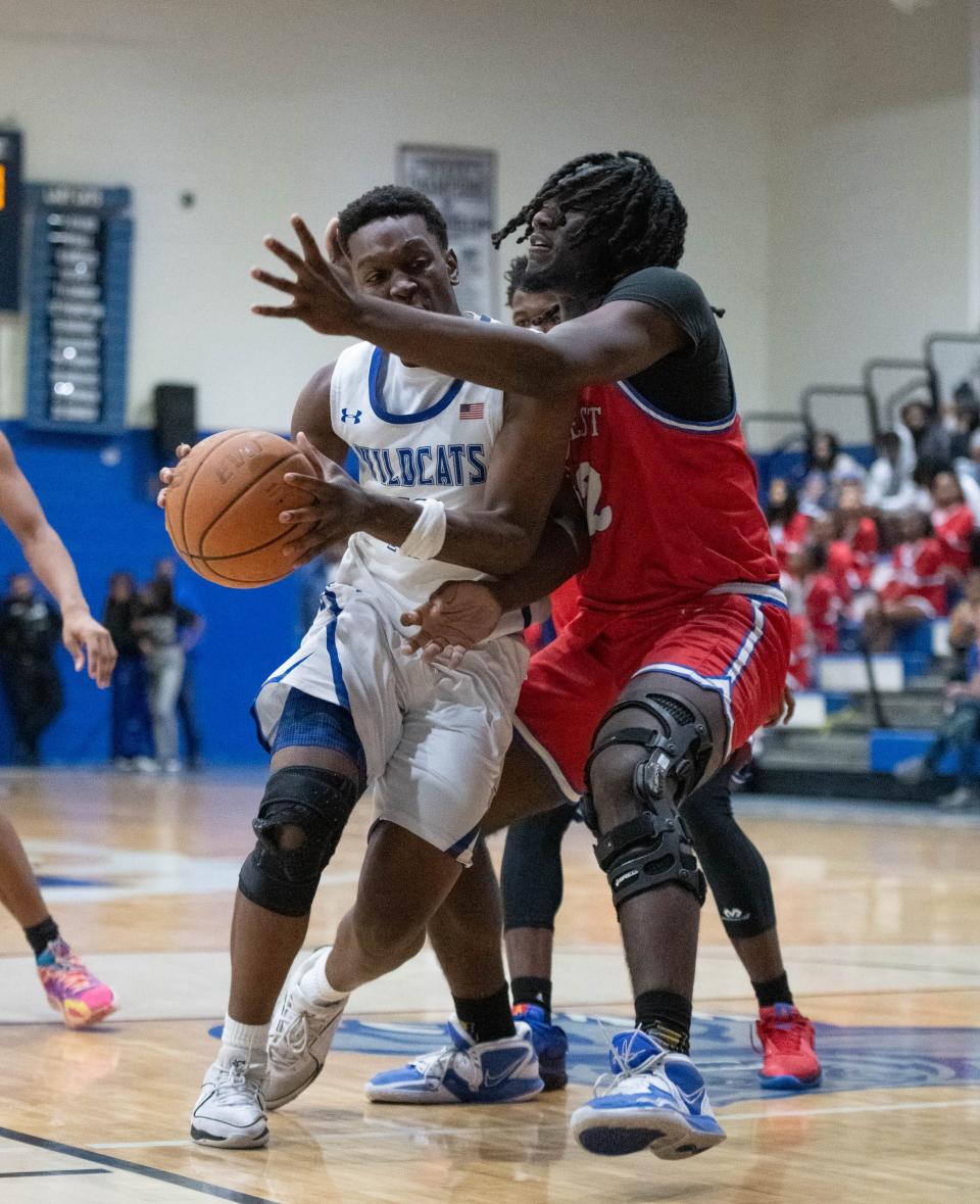 Tyshawn Roper (10) is fouled while driving to the hoop during the Pine Forest vs Washington boys basketball game at Booker T. Washington High School in Pensacola on Friday, Jan. 19, 2024.