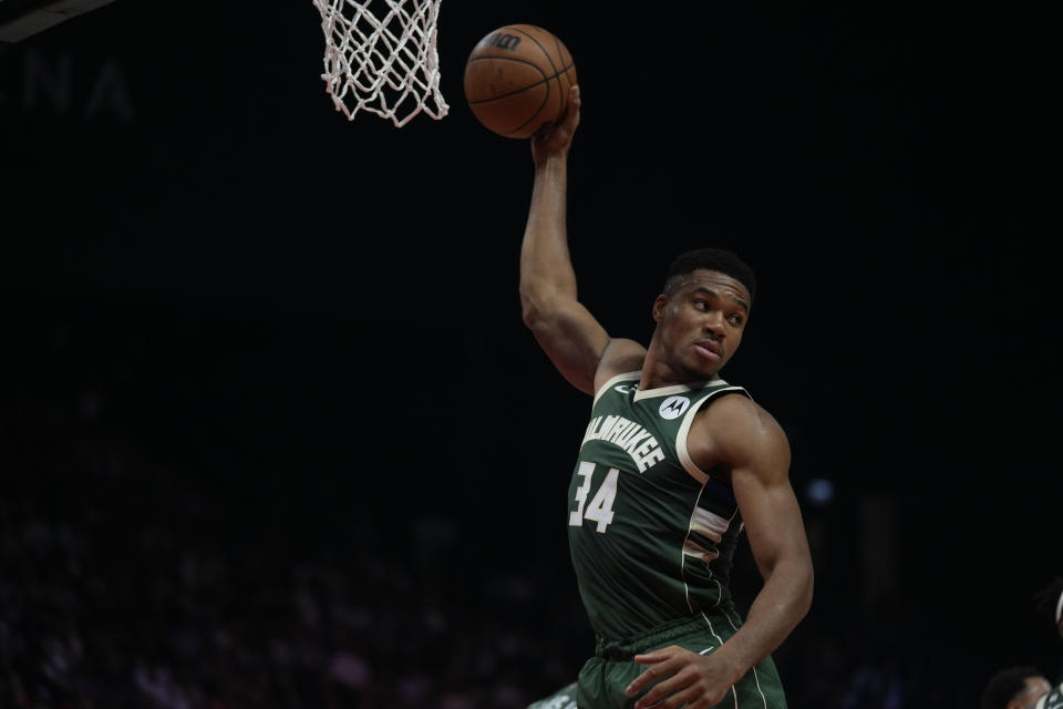 Giannis Antetokounmpo of Milwaukee Bucks rebound during a preseason NBA basketball against Atlanta Hawks game in Abu Dhabi, United Arab Emirates, Thursday, Oct. 6, 2022. (AP Photo/Kamran Jebreili)