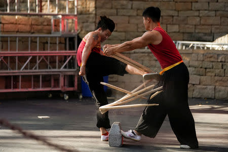 Martial artist Ren Ruzhi, 24, shows off his kung-fu skills before a bullfight in Jiaxing, Zhejiang province, China October 27, 2018. REUTERS/Aly Song