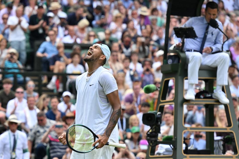 Australia's Nick Kyrgios celebrates winning against US Brandon Nakashima at the end of their round of 16 men's singles tennis match on the eighth day of the 2022 Wimbledon Championships at The All England Tennis Club in Wimbledon, southwest London, on July 4, 2022. - RESTRICTED TO EDITORIAL USE (Photo by Glyn KIRK / AFP) / RESTRICTED TO EDITORIAL USE (Photo by GLYN KIRK/AFP via Getty Images)