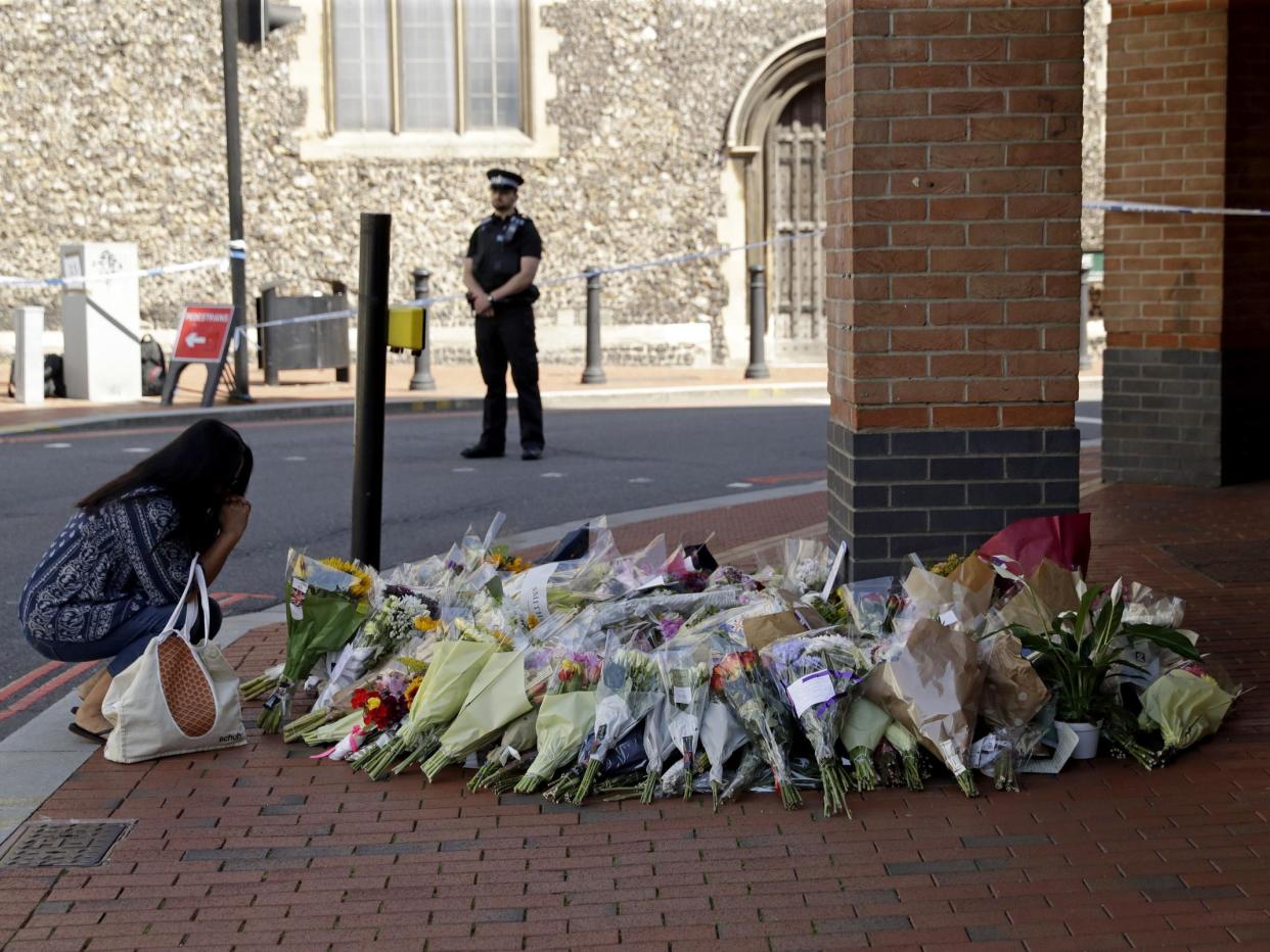 <p>Floral tributes in Forbury Gardens, Reading, where the attack happened in June 2020</p> (AP)