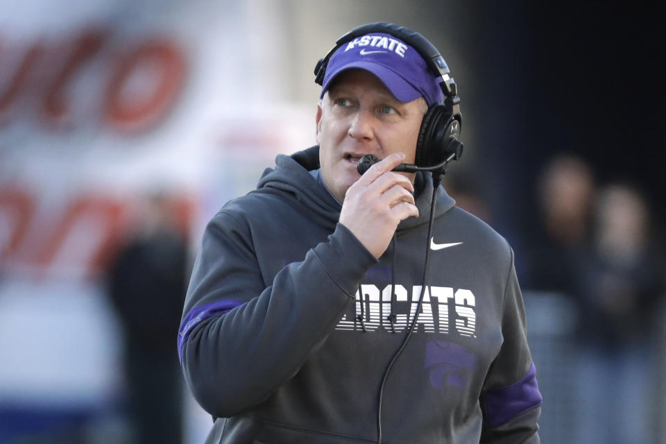 FILE - In this Dec. 31, 2019, file photo, Kansas State coach Chris Klieman watches from the sideline during the first half of the team's Liberty Bowl NCAA college football game against Navy in Memphis, Tenn. The Big Ten and Pac-12 became the first Power Five conferences to cancel their fall football seasons because of concerns about COVID-19. The announcements left the Atlantic Coast Conference, the Southeastern Conference and the Big 12 as thePower Five conferences still intending to play in the fall, and left Klieman clinging to hope. “I hope they don't totally lose a season," he said of his players. (AP Photo/Mark Humphrey, File)