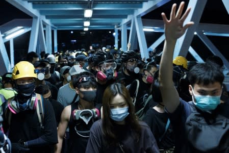 Protesters retreat from police outside Yuen Long MTR station in Yuen Long, New Territories, Hong Kong