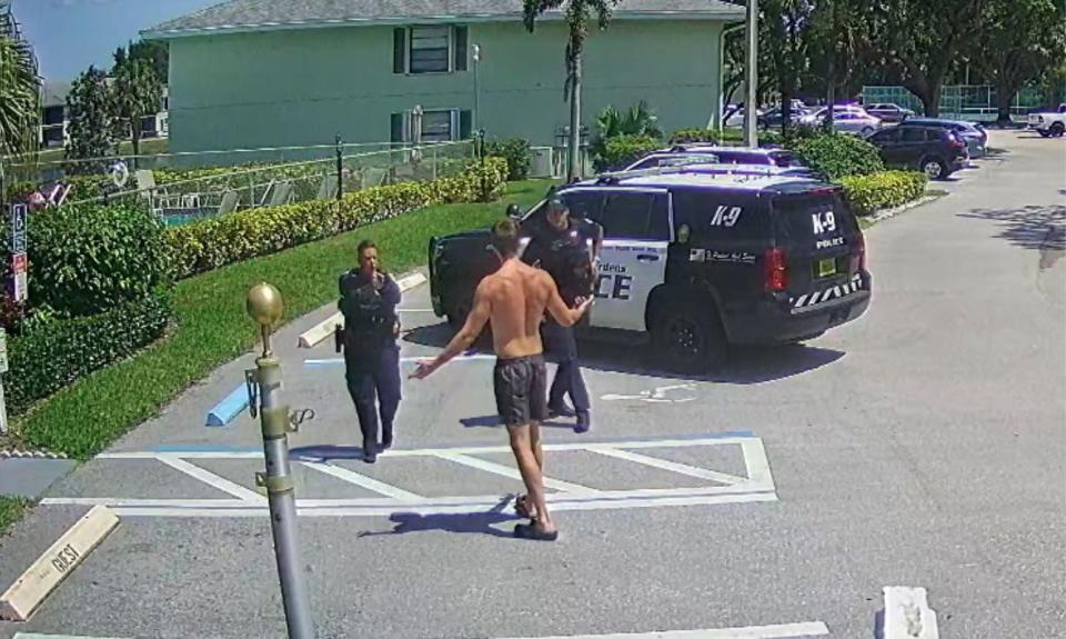 Former Palm Beach Florida police officer Bethany Guerriero drawing her gun on Ryan Gould after he called for help.