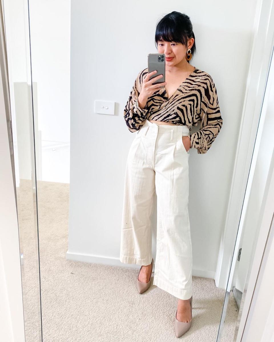 Angel showcasing the $25 Kmart pleated jeans. Photo: Instagram/styling_mumandbub.