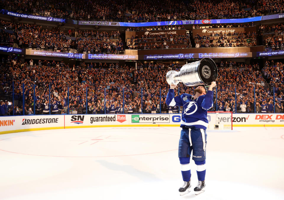 TAMPA, FLORIDA - JULY 07: Steven Stamkos #91 of the Tampa Bay Lightning kisses the Stanley Cup after their 1-0 win in Game Five of the 2021 Stanley Cup Final to win the series four games to one against the Montreal Canadiens at Amalie Arena on July 07, 2021 in Tampa, Florida. (Photo by Florence Labelle/NHLI via Getty Images)