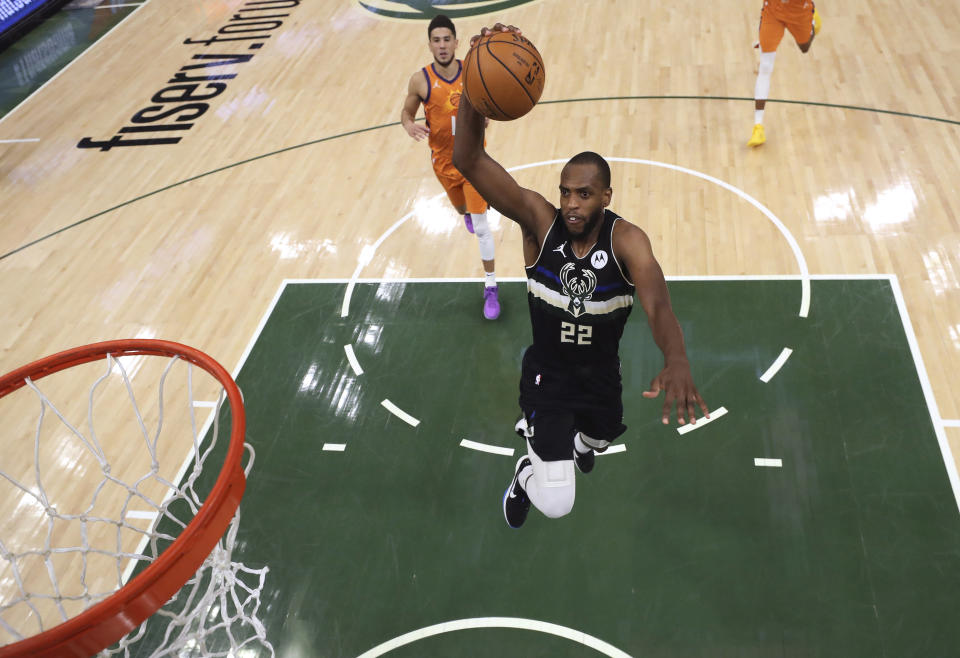 Milwaukee Bucks' Khris Middleton goes up for a dunk against the Phoenix Suns during the second half of Game 6 of basketball's NBA Finals, Tuesday, July 20, 2021, in Milwaukee. (Justin Casterline/Pool Photo via AP)