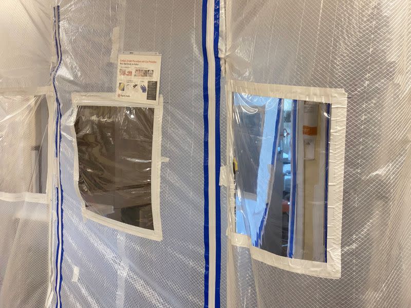A protective screen is seen at the entrance to a negative pressure ICU hospital room, where COVID-19 patients are treated, at St John's Regional Medical Center in Oxnard