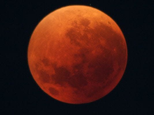 A total lunar eclipse, with the moon appearing red in color, is seen in Japan on Aug. 28, 2007.