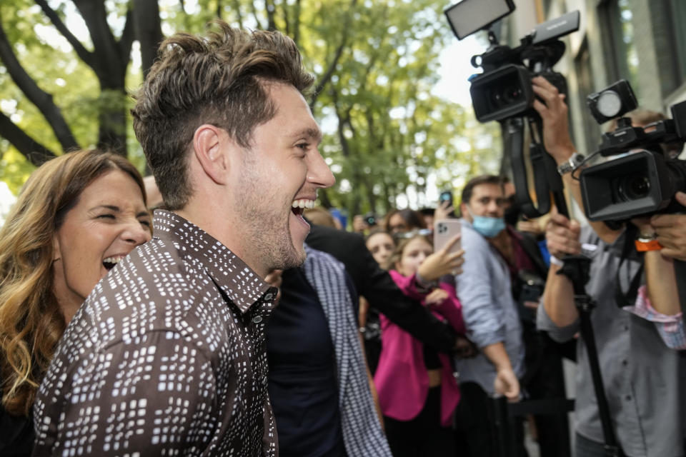 Niall Horan arrives for the Emporio Armani Spring Summer 2022 collection during Milan Fashion Week, in Milan, Italy, Thursday, Sept. 23, 2021. (AP Photo/Luca Bruno)