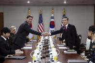 U.S. Defense Secretary Mark Esper, left, shakes hands with South Korean Defense Minister Jeong Kyeong-doo, right, during their meeting Friday, Nov. 15, 2019 in Seoul, South Korea. (Chung Sung-Jun/Getty Images via AP)