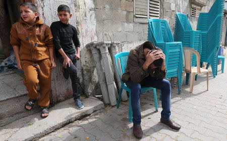 Palestinian relatives of 18-year-old fisherman Feras Meqdad, who Palestinian health officials said was shot dead by Egyptian forces, react during his funeral in Rafah in the southern Gaza Strip November 6, 2015. REUTERS/Ibraheem Abu Mustafa