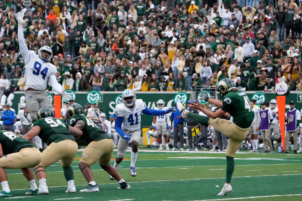 Sep 10, 2022; Fort Collins, Colorado, USA; Middle Tennessee Blue Raiders defensive end Ralph Mency (94) tries to block a punt by Colorado State Rams punter Paddy Turner (41)  at Sonny Lubick Field at Canvas Stadium. Mandatory Credit: Michael Madrid-USA TODAY Sports