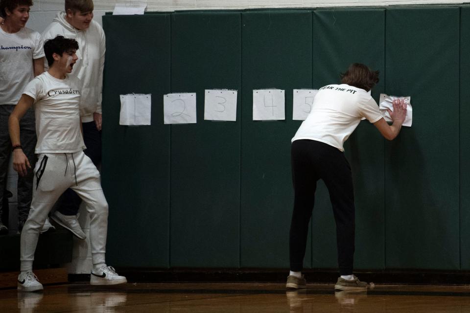 Lansdale Catholic students count down the number of points senior Gabby Casey needs to shoot to become the school's all-time leading scorer in girls basketball during their game against Bonner and Prendergast Catholic at Lansdale Catholic High School on Tuesday, Jan. 10, 2023.