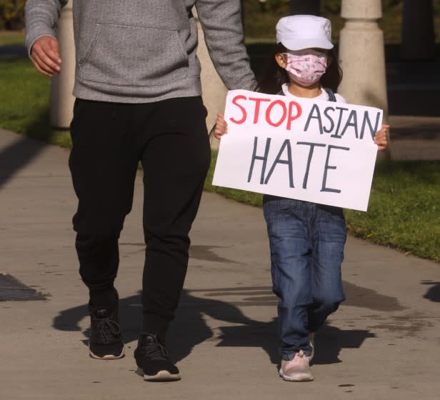 SAN GABRIEL, CA - MARCH 26, 2021 - - Summer Trinh, 5, joins around 200 residents, students and Alhambra and San Gabriel city leaders who participate in a march to denounce anti-Asian sentiment, racism and hate crimes that have been exacerbated by the COVID-19 pandemic in San Gabriel on March 26, 2021. The march started at San Gabriel City Hall and proceeded to Alhambra City Hall. (Genaro Molina / Los Angeles Times)