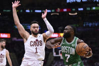 Boston Celtics guard Jaylen Brown (7) drives on Cleveland Cavaliers guard Max Strus (1) during the second half of Game 4 of an NBA basketball second-round playoff series, Monday, May 13, 2024, in Cleveland. (AP Photo/David Dermer)