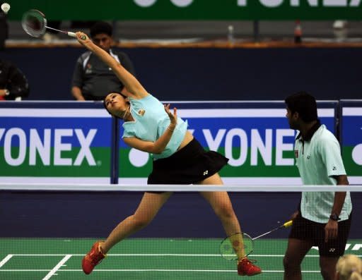 Diju Valiyaveetil, right, and Jwala Gutta of India play a World Badminton Championships match against Poland in Hyderbad in 2009. A new ruling that requires female badminton players to wear skirts on court is causing unease among players as they prepare to adopt the new compulsory dress code