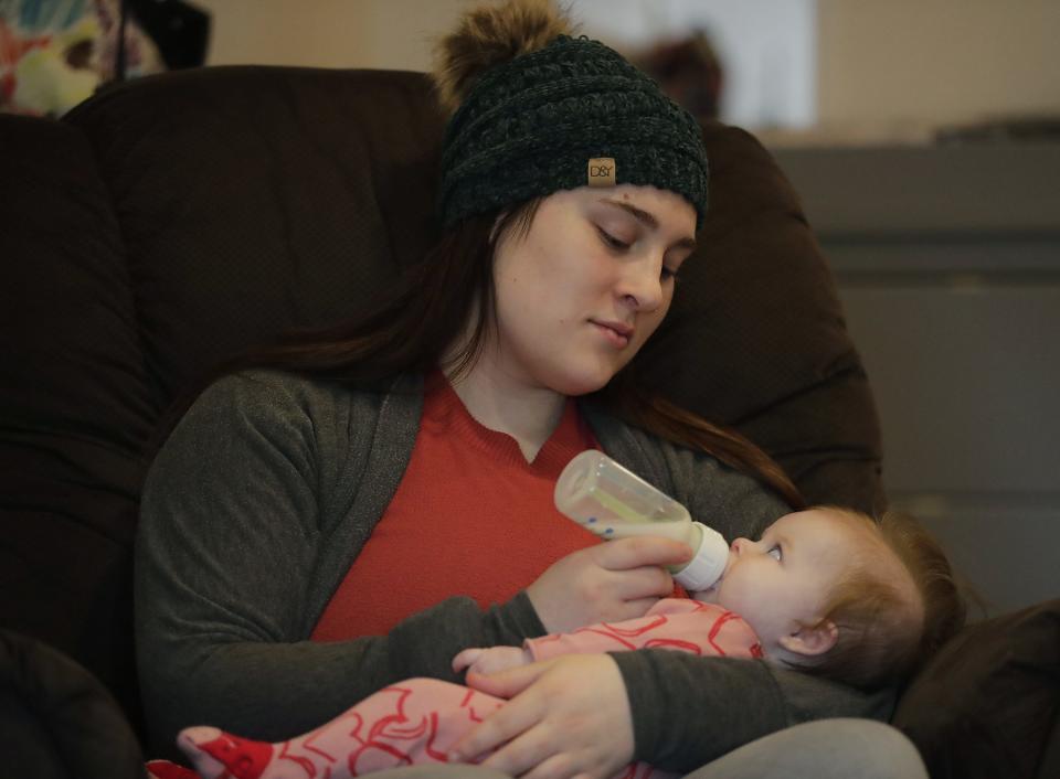 Assistant teacher Kathryn Novak bottle feeds Ava at Joyful Beginnings Academy, a new childcare center, recently opened in the former Kuddly Kids Child Care building on Tuesday, February 14, 2023 in Dale, Wis. 
Wm. Glasheen USA TODAY NETWORK-Wisconsin