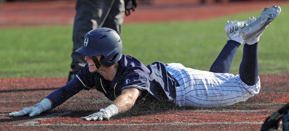 Hoban baserunner Parker Falkenstein scores the Knights' only run during the sixth inning of a Division I regional semifinal baseball game against University School, Thursday, June 1, 2023, in Oberlin, Ohio.