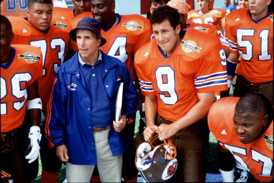 Sandler went on to be a top box office draw in slapstick comedies including the 1998 film "Waterboy" with Henry Winkler, left.