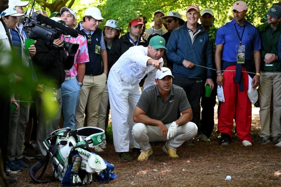Brooks Koepka and his caddie Ricky Elliott in a tricky spot on the eighth hole of the final round