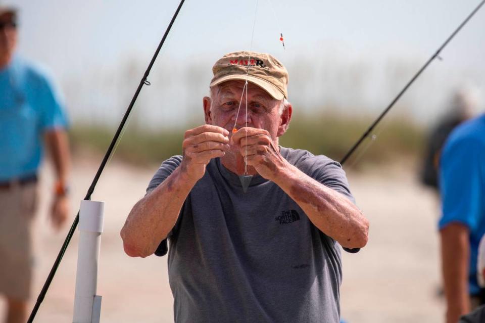 Woody Smith rigs up his baits for a session of surf fishing at Huntington Beach State Park. The South Carolina Department of Natural Resources with the help of volunteers put on a surf fishing clinic at Huntington Beach State Park on Thursday. July 14, 2022.