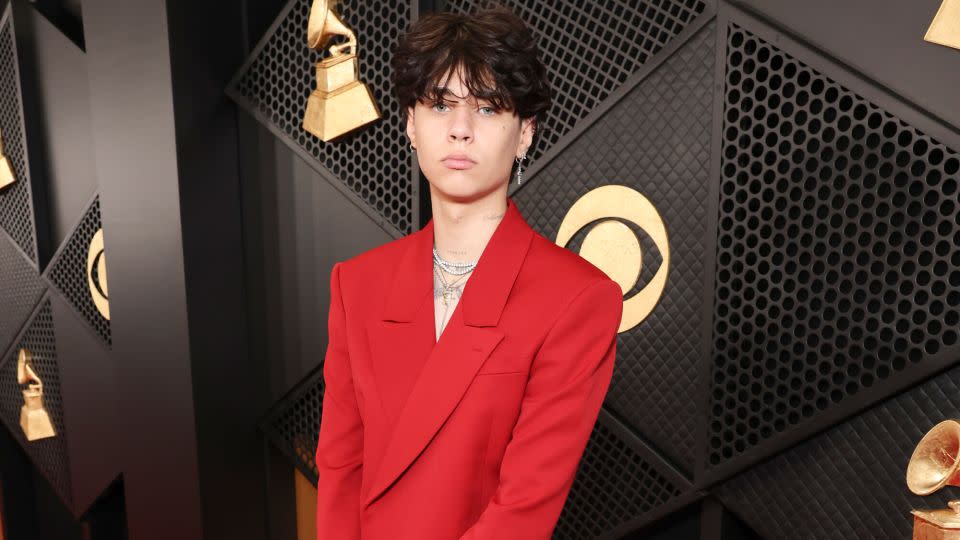 Musician Travis Barker’s son, Landon Barker, went shirtless underneath his all-red suit. - Stewart Cook/CBS Entertainment