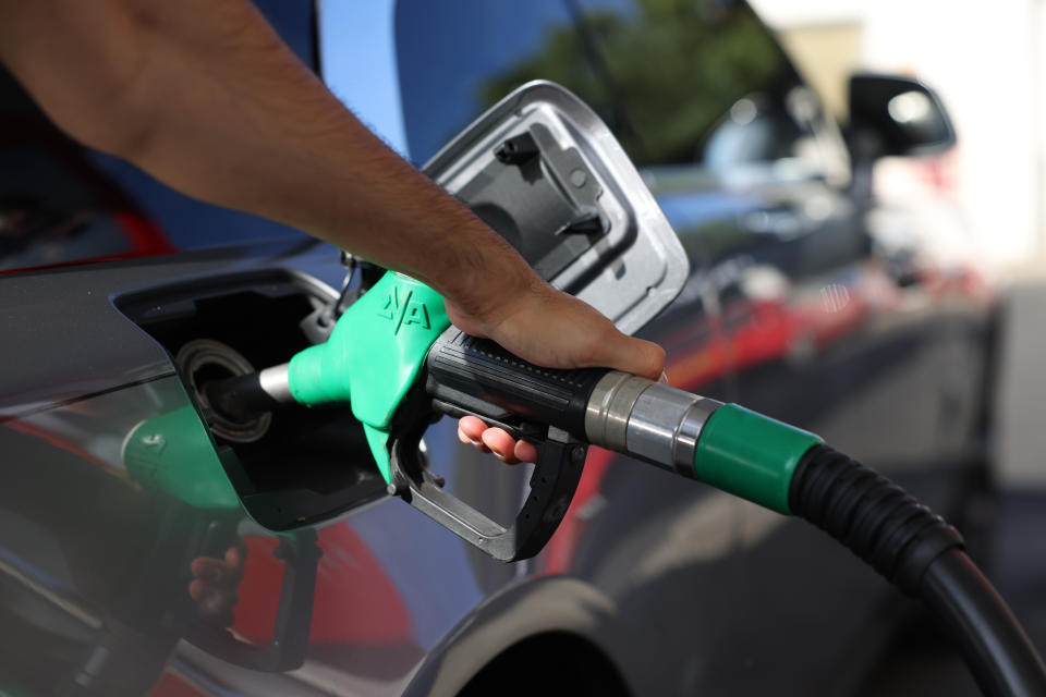 Petrol prices LONDON, ENGLAND - JULY 24: A driver pumps fuel at an Esso Tesco petrol station on July 24, 2022 in London, England. Many Supermarket Fuel Stations are still charging high prices on the forecourt despite wholesale prices coming down over the last few weeks. (Photo by Hollie Adams/Getty Images)