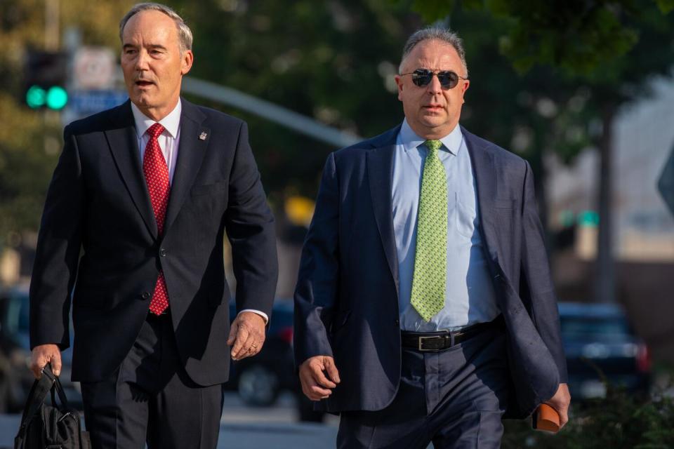 Paul Paradis and David Scheper walking side by side