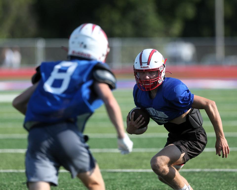 Pleasant Plains' Danny Skelton carries the ball during practice on Thursday, August 10, 2023.