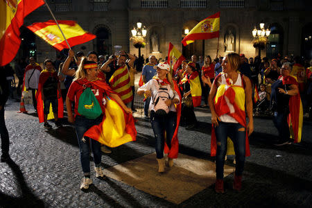 Pro-unity supporters dance at Sant Jaume square after taking part in a demonstration in central Barcelona, Spain, October 29, 2017. REUTERS/Jon Nazca