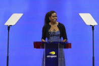 Former first lady Michelle Obama speaks at the opening ceremony of the of the U.S. Open tennis championships, Monday, Aug. 28, 2023, in New York. (AP Photo/Jason DeCrow)