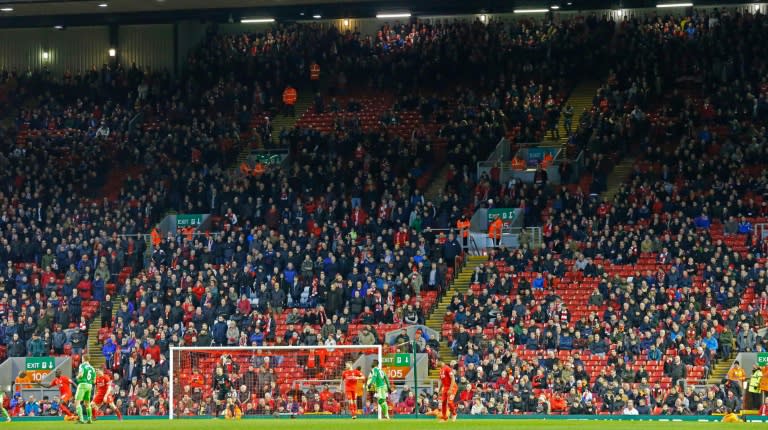 Liverpool fans leave the stands at the Kop End after 77 minutes' of play during the English Premier League football match between Liverpool and Sunderland at Anfield in Liverpool, England, on February 6, 2016, in protest against rising ticket prices