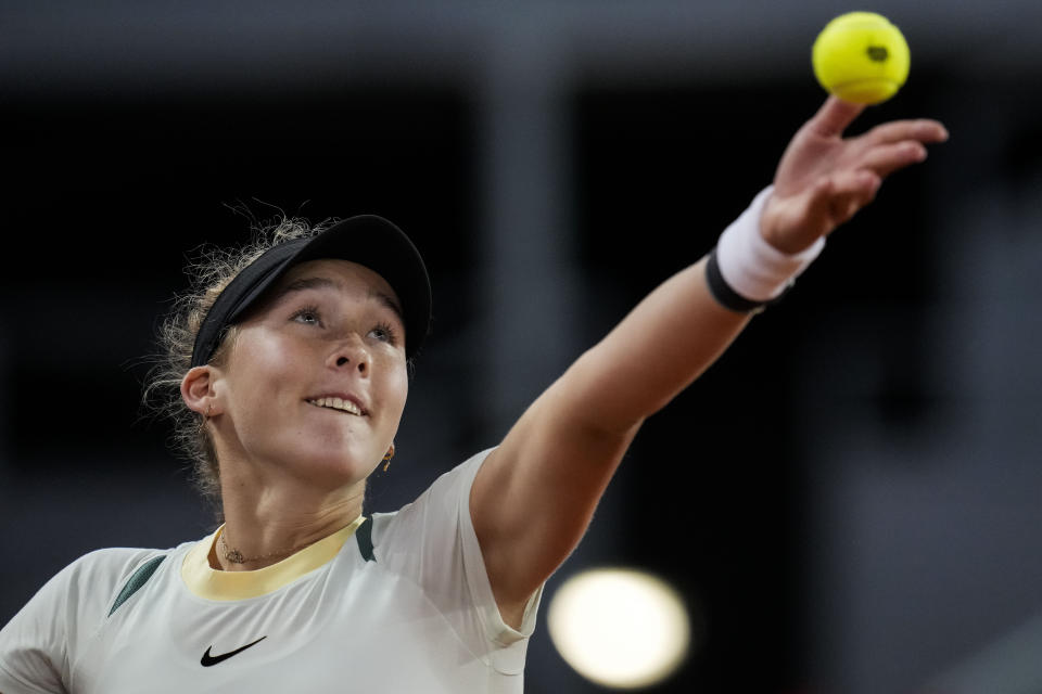 Mirra Andreeva, of Russia, serves a ball to Aryna Sabalenka, of Belarus, during the Mutua Madrid Open tennis tournament in Madrid, Wednesday, May 1, 2024. (AP Photo/Manu Fernandez)