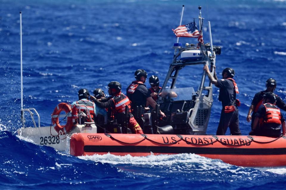 The crew of USCGC Oliver Henry (WPC 1140), having rescued three mariners stranded on Pikelot Atoll, Yap State, Federated States of Micronesia, prepare the cutter boat and the mariners to be recovered to the cutter for further transport to Polowat Atoll, Chuuk State, on April 9, 2024.  / Credit: U.S. Coast Guard photo