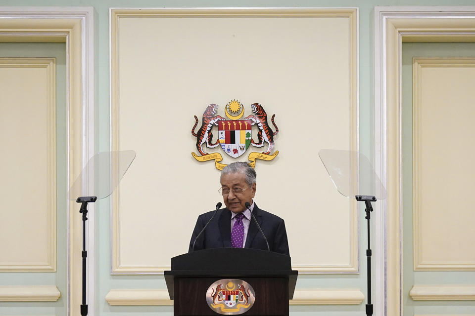 FILE - In this Feb. 27, 2020, file photo, Malaysian interim leader Mahathir Mohamad speaks during a press conference at his office in Putrajaya, Malaysia. Former Prime Minister Mahathir has been ousted from his Malay party in the latest twist to a power struggle with his successor Muhyiddin Yassin, but he has vowed to challenge the move. The 94-year-old Mahathir, along with his son and three other senior members, were expelled from the Bersatu party on Thursday, May 28, 2020. (AP Photo/Vincent Thian, File)