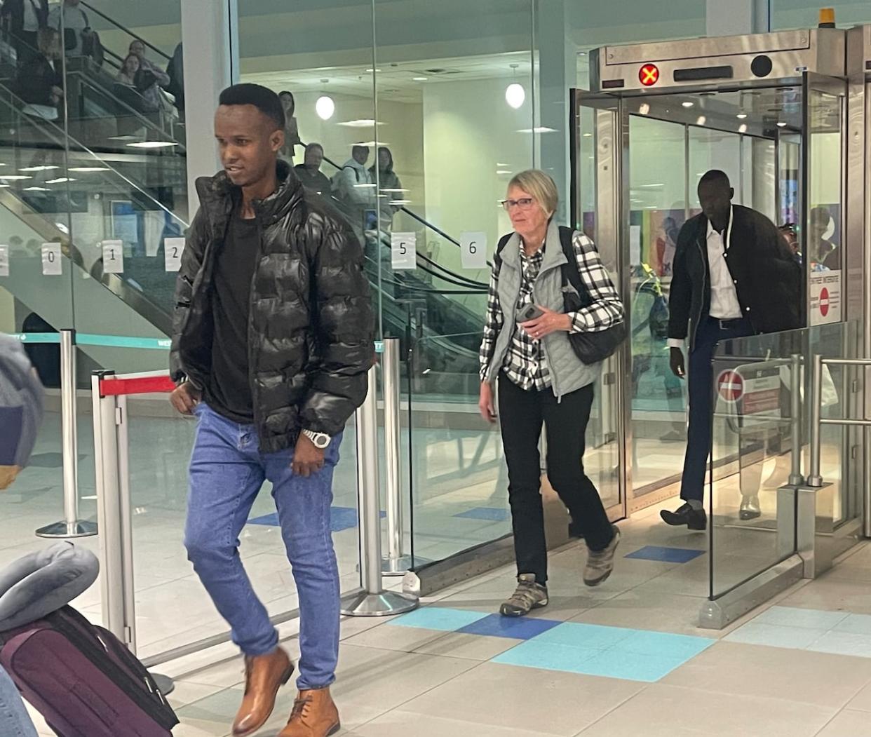 Abdifatah Sabriye, a refugee for nearly 15 years, arrived at Halifax Stanfield International Airport Friday night, now a permanent resident of Canada. (Kayla Hounsell/CBC - image credit)