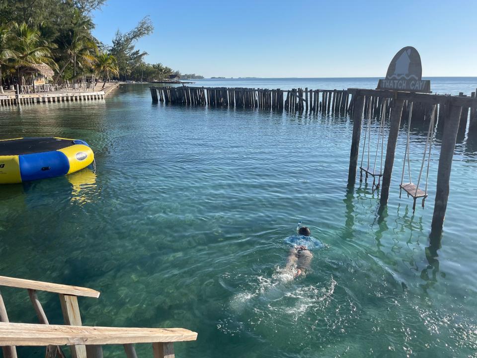 The author's friend swimming in the water.