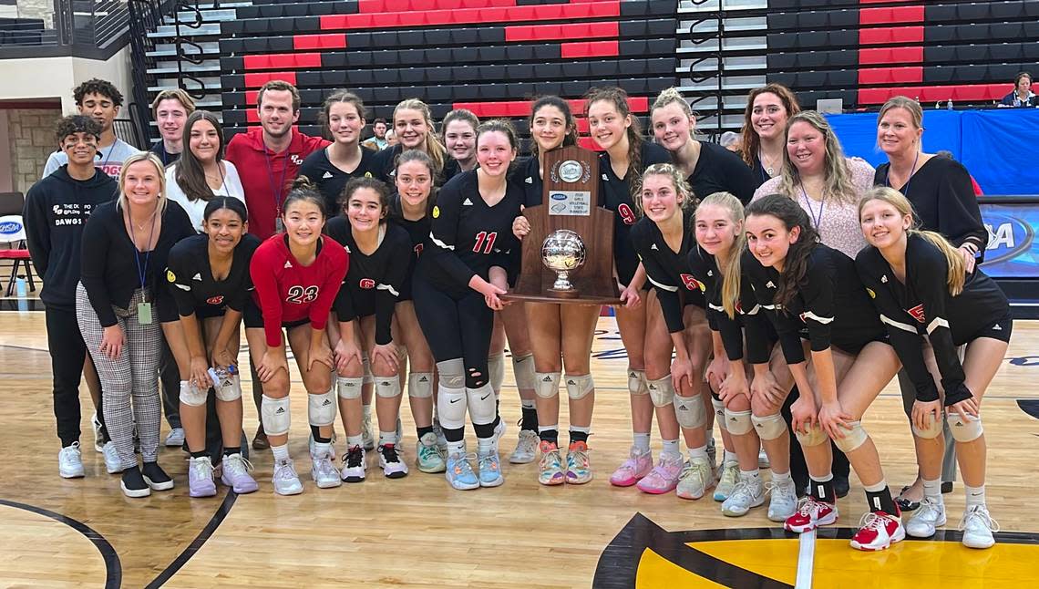 Paul Laurence Dunbar players and coaches posed with the KHSAA State Volleyball Tournament runner-up trophy after their loss to Notre Dame in the finals on Friday night.