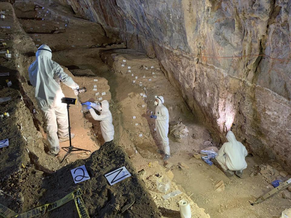 In this February 2019 photo provided by Mads Thomsen, researchers take samples from different cultural layers in a cave in Zacatecas, central Mexico. Artifacts from the site suggest people were living in North America much earlier than most scientists think. Researchers reported Wednesday, July 22, 2020, that tools found in the cave date to as early as 26,500 years ago, about 10,000 years before the generally accepted date for the earliest human presence in North America. (Mads Thomsen via AP)
