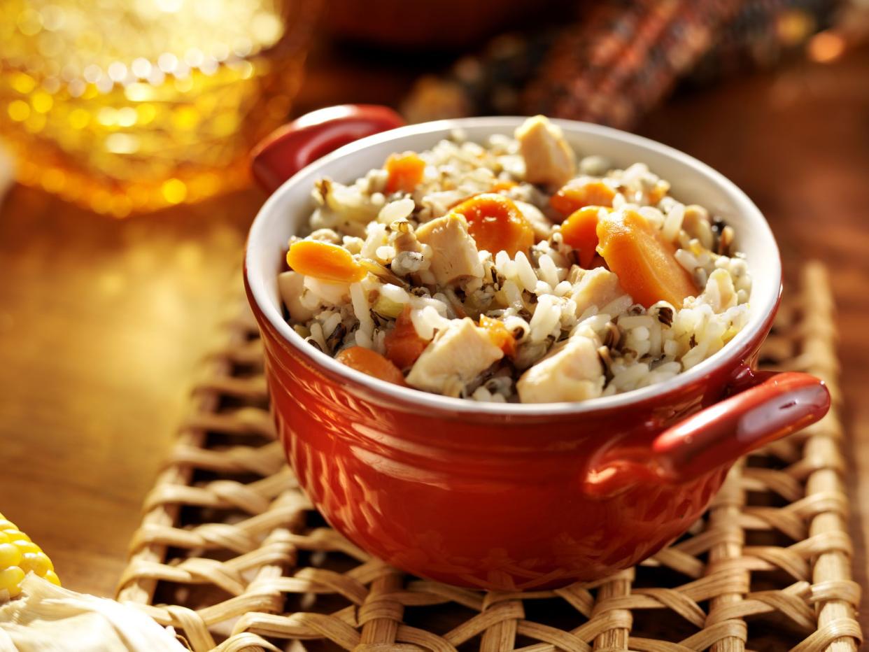 close up photo of chicken and wild rice with carrots