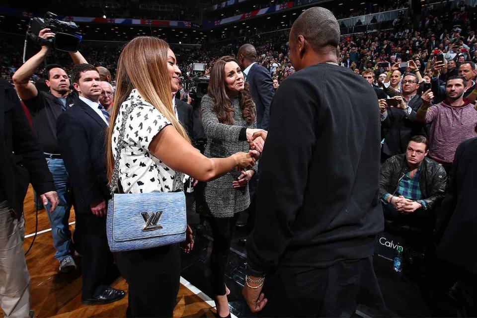 Singer Beyonce and Husband Jay-Z greets The Duchess of Cambridge in the game of the Cleveland Cavaliers against the Brooklyn Nets at the Barclays Center on December 8, 2014 in the Brooklyn borough of New York City.