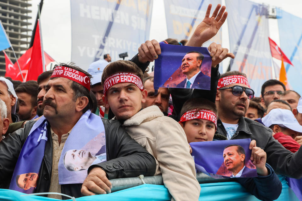 People listen to Turkish President and People's Alliance's presidential candidate Recep Tayyip Erdoğan during an election campaign rally in Ankara on April 30.<span class="copyright">Ali Unal—AP</span>